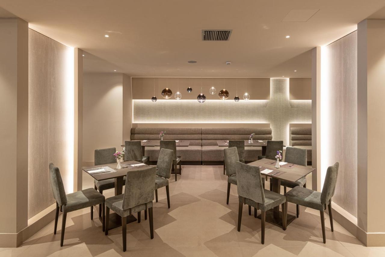 Holiday Inn Thessaloniki By Ihg Kültér fotó The interior of the restaurant
