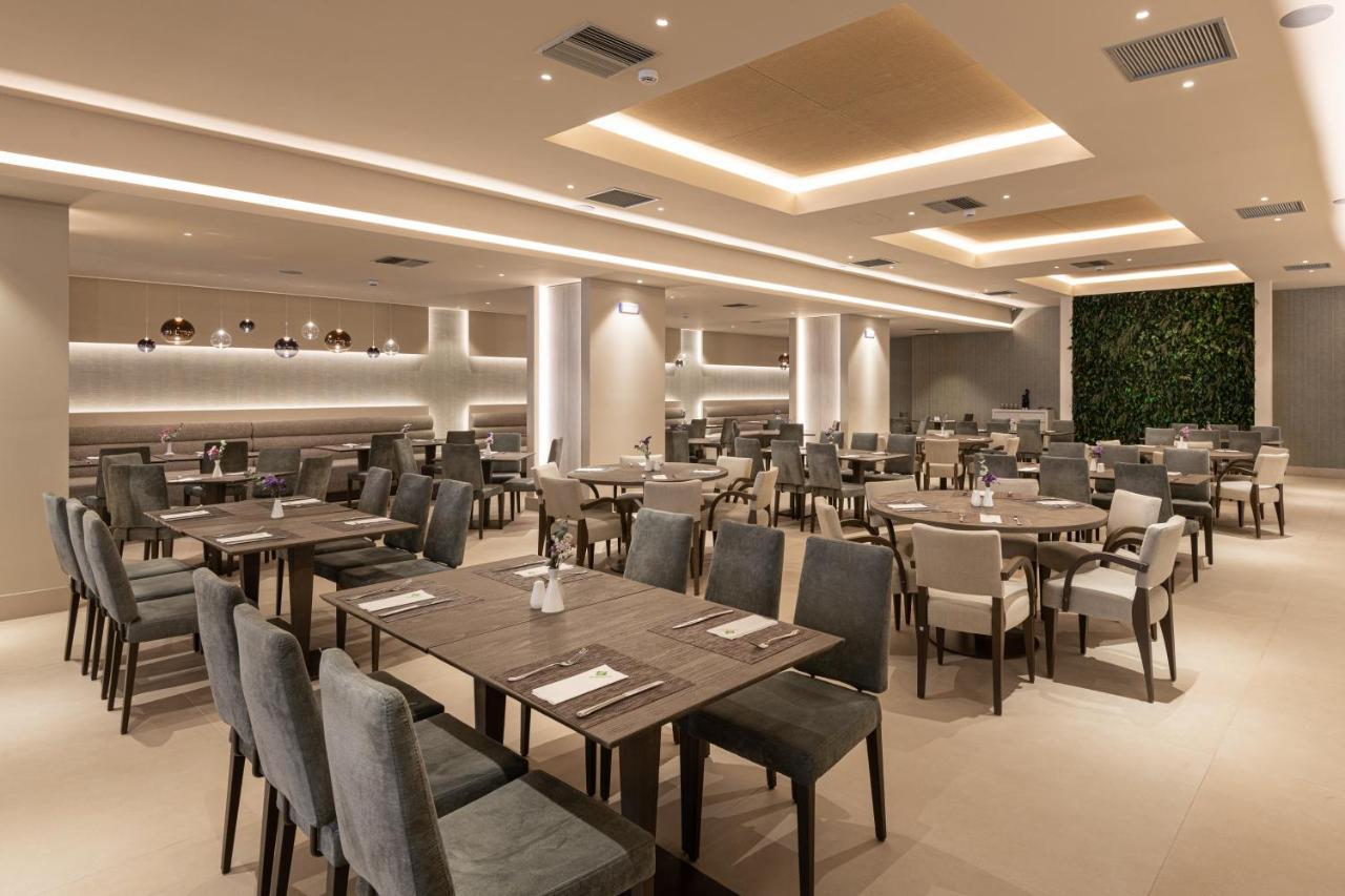 Holiday Inn Thessaloniki By Ihg Kültér fotó The interior of the restaurant